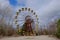 The famous Ferris wheel in an abandoned amusement park in Pripyat. Cloudy weather in the Chernobyl exclusion zone