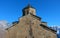 Famous Gergeti Trinity Church under Mount Kazbek in Winter. Georgia