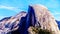 The famous granite Half Dome rock formation in the Eastern Yosemite Valley of the Sierra Nevada Mountains