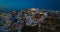 The Famous greek iconic  tourist destination Oia village  in the night with traditional white houses and windmills in Santorini