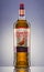 The Famous Grouse blended whisky on gradient background.