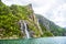 Famous Hengjanefossen waterfall coming down from a steep rock face into Lysefjord.