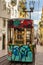 Famous hill tram with graffiti in Lisbon, Portugal. Electric elevator train. Portuguese transport concept. Street art graffiti.