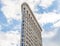 Famous and Historic Flatiron Building, Triangular 22 Story Steel Framed Landmark in Manhattan, New York City. Sky in Background