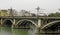 Famous and historic Triana bridge in the city of Seville, Andalusia, Spain