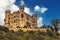 Famous Hohenschwangau bavarian castle and cloudy sky