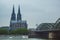 The famous Hohenzollern Bridge with the Cologne Cathedral on a cloudy day in Cologne, Germany