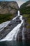 The famous and impressive waterfall The Suitor Friaren dropping down the rocks into the Geiranger Fjord