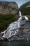 The famous and impressive waterfall The Suitor Friaren dropping down the rocks into the Geiranger Fjord