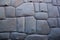 Famous Inca angled stone in Hatun Rumiyoc wall, an archeological artefact in Cuzco, Peru.