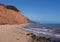The famous Jurassic Coast red cliffs at Sidmouth, Devon, England. Looking East from Sidmouth Beach. No people.