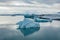 Famous Jökulsárlón Glacier Lagoon in Iceland with several huge ice floes floating on the water