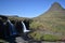 Famous kirkjufell mountain with the kirkjufell falls waterfalls in front in GrundarfjÃ¶dur in Iceland