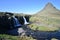 Famous kirkjufell mountain with the kirkjufell falls waterfalls in front in Iceland