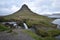 Famous kirkjufell mountain with the kirkjufell falls waterfalls in front in Iceland