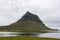 Famous Kirkjufell volcano reflected in water of.