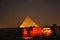 Famous land with Egyptian gods, pyramids at night and amazing light plays