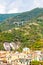 The famous landscape and cityscape of Monterosso Al Mare with green mountains high bridge and traditional city buildings