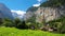 Famous Lauterbrunnen valley with gorgeous waterfall and Swiss Alps in the background, Switzerland, Europe.