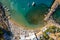 Famous lindos beach in Rhodes. sunbeds, beach, sand, waves, top view from drone. The island of Rhodes Greece.