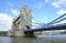 The famous London landmark, The Tower Bridge across Thames river with blue sky