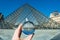 Famous Louvre Museum Pyramid through the crystal ball, Paris, France