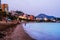 Famous Malagueta beach in Malaga, Spain at night. Coastline and motion blurred waves at sunset