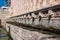 Famous mediaeval Fountain of 99 Spouts in ithe old town of L\\\'Aquila, Italy