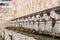 Famous mediaeval Fountain of 99 Spouts in ithe old town of L\\\'Aquila, Italy