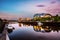 Famous Millennium bridge at sunset. Illuminated landmarks with r