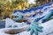 Famous mosaic lizard or salamander fountain in Park Guell. Mosaic sculpture in the Parc Guell designed by Antoni Gaudi located on