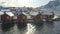 Famous multicolored wooden fishing houses rorbu on a sea shore