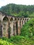 The famous nine-arch bridge of the railway in the jungle in Sri Lanka