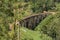 The famous nine-arch bridge of the railway in the jungle in Sri Lanka