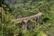 The famous nine-arch bridge of the railway in the jungle in Sri Lanka