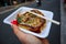 Famous okonomiyaki as street food in Osaka