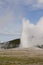 Famous Old Faithful geyser going off in Yellowstone National Park