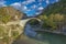 The famous old stoned bridge of Konitsa over Aoos river. Tymfi mount, Zagori, Epirus, Greece, Europe