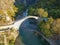 The famous old stoned bridge of Konitsa over Aoos river. Tymfi mount, Zagori, Epirus, Greece, Europe