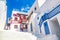 Famous old town narrow street with white houses. Mykonos island, Greece