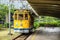 The famous old tram Bonde de Santa Teresa in Rio de Janeiro, Brazil. Yellow tram traveling through Rio de Janeiro