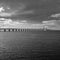 Famous Oresund Bridge over the coast in Malmo, Sweden, grayscale shot