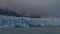 The famous Perito Moreno glacier on the background of a turquoise lake and mountains