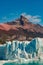 Famous Perito Moreno glacier and mountain turquoise lagoon with austral forests at golden Autumn in Patagonia, South America,
