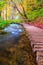 Famous Plitvice lakes and wooden footpath with beautiful autumn colors and magnificent views of the waterfalls at  Plitvice