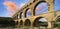 Famous Pont du Gard at sunset, old roman aqueduct in France