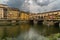 Famous Ponte Vecchio bridge and cityscape view of old town Florence by Arno river in Florence, Italy