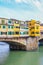 Famous Ponte Vecchio Bridge, medieval stone bridge over the Arno River in Florence, Tuscany, Italy. Major landmark of the Italian