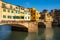 Famous Ponte Vecchio with river Arno at sunset in Florence, Italy