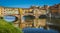 Famous Ponte Vecchio with river Arno at sunset in Florence, Italy